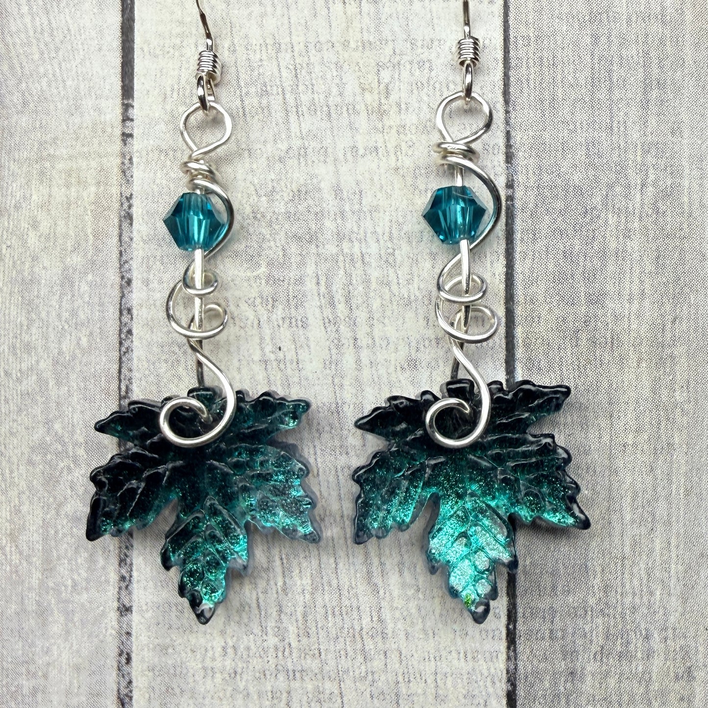 under summer skies: dark teal leaf earrings