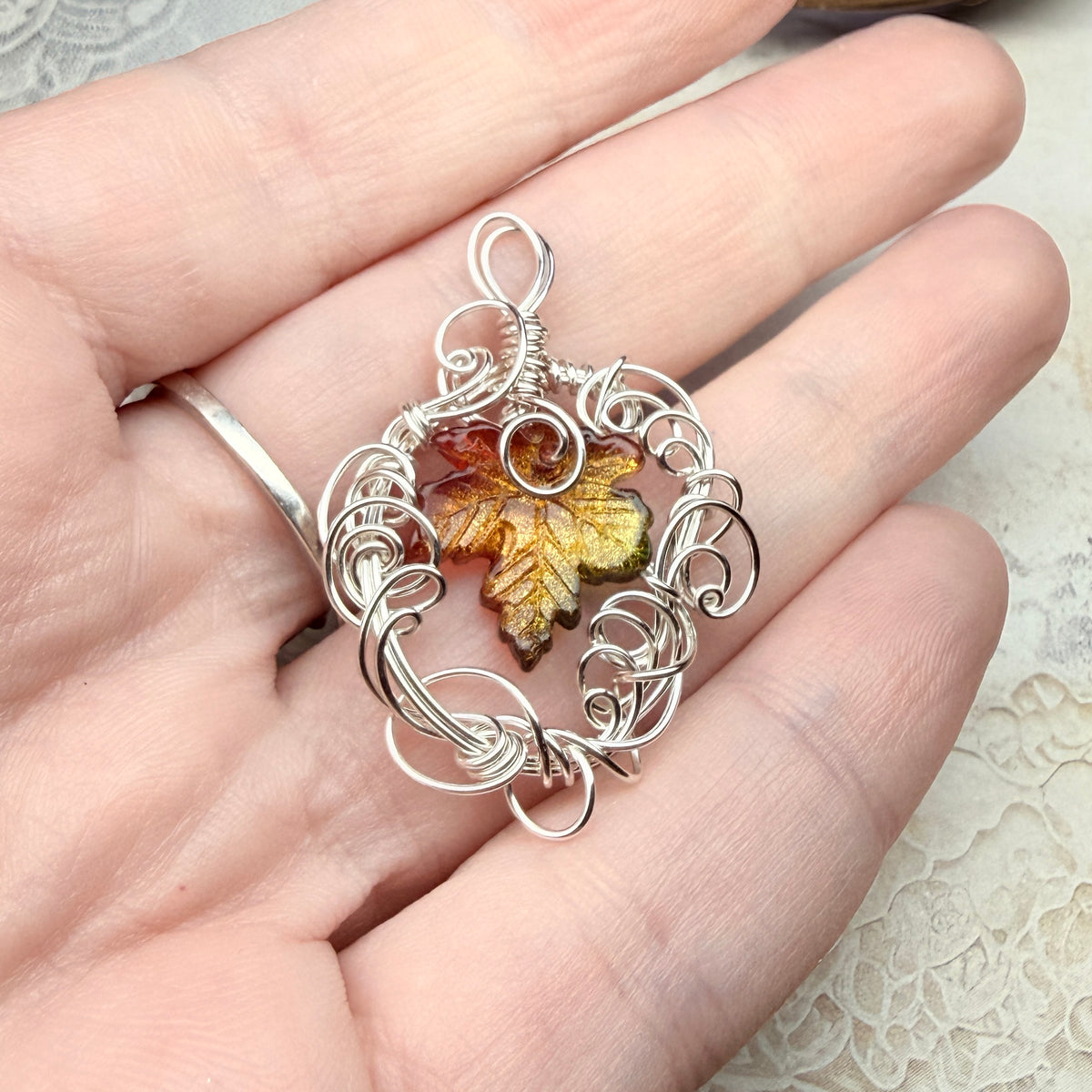 on autumn winds: green and orange leaf pendant