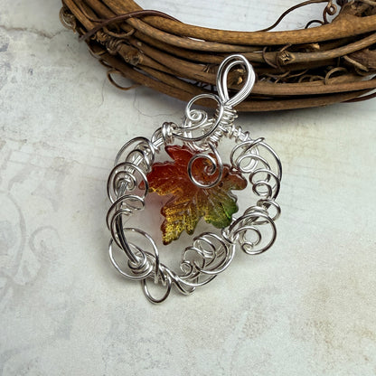 on autumn winds: green and orange leaf pendant