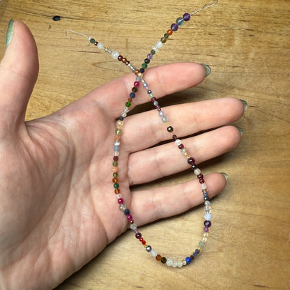 what is this, a scoop for ants? (tiny gemstone bead scoops)