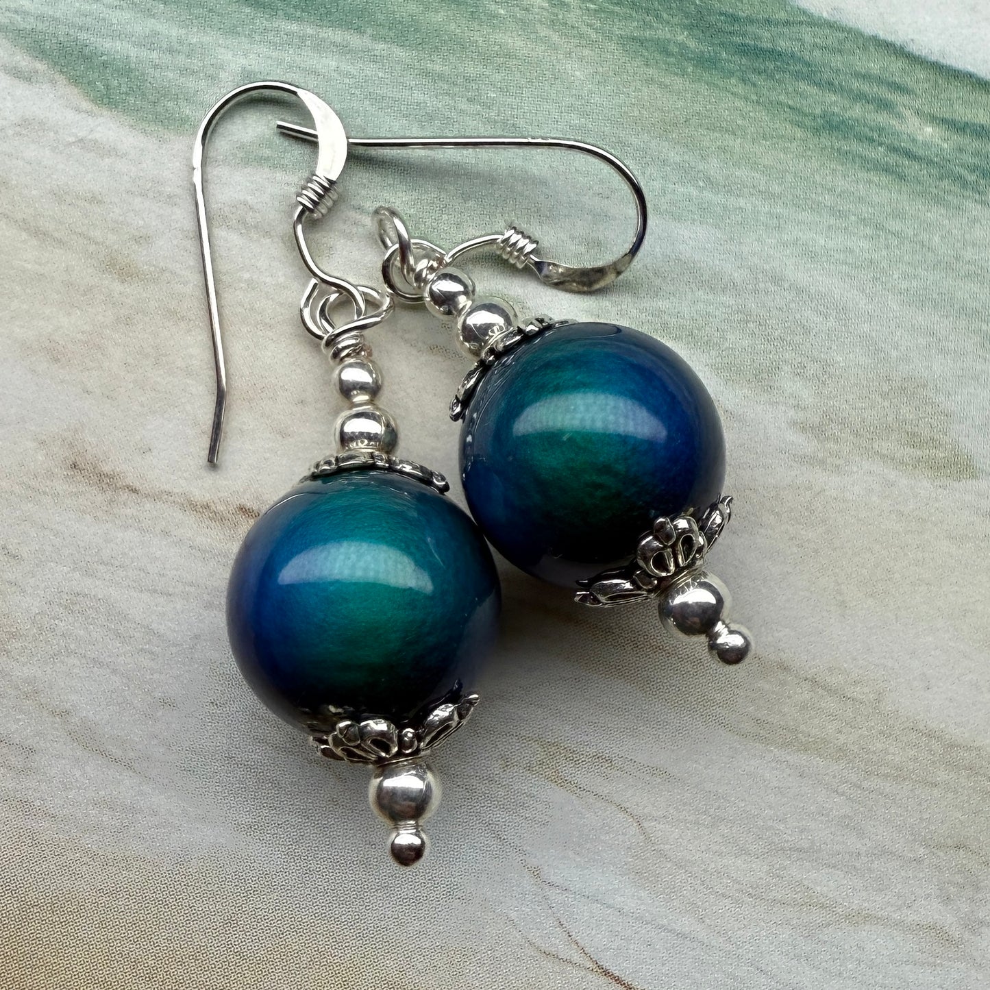 on the turning tide - thermal color-shift earrings