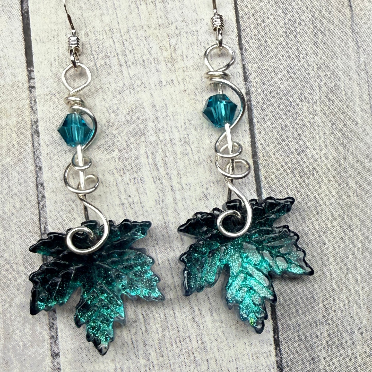 under summer skies: dark teal leaf earrings