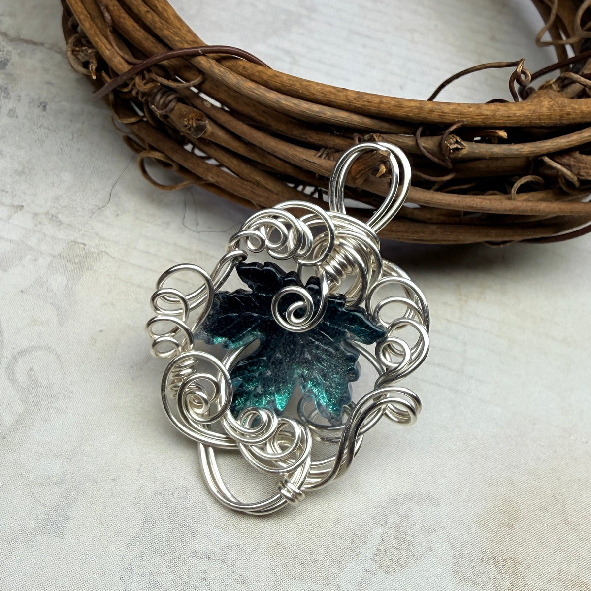 on autumn winds: teal leaf pendant