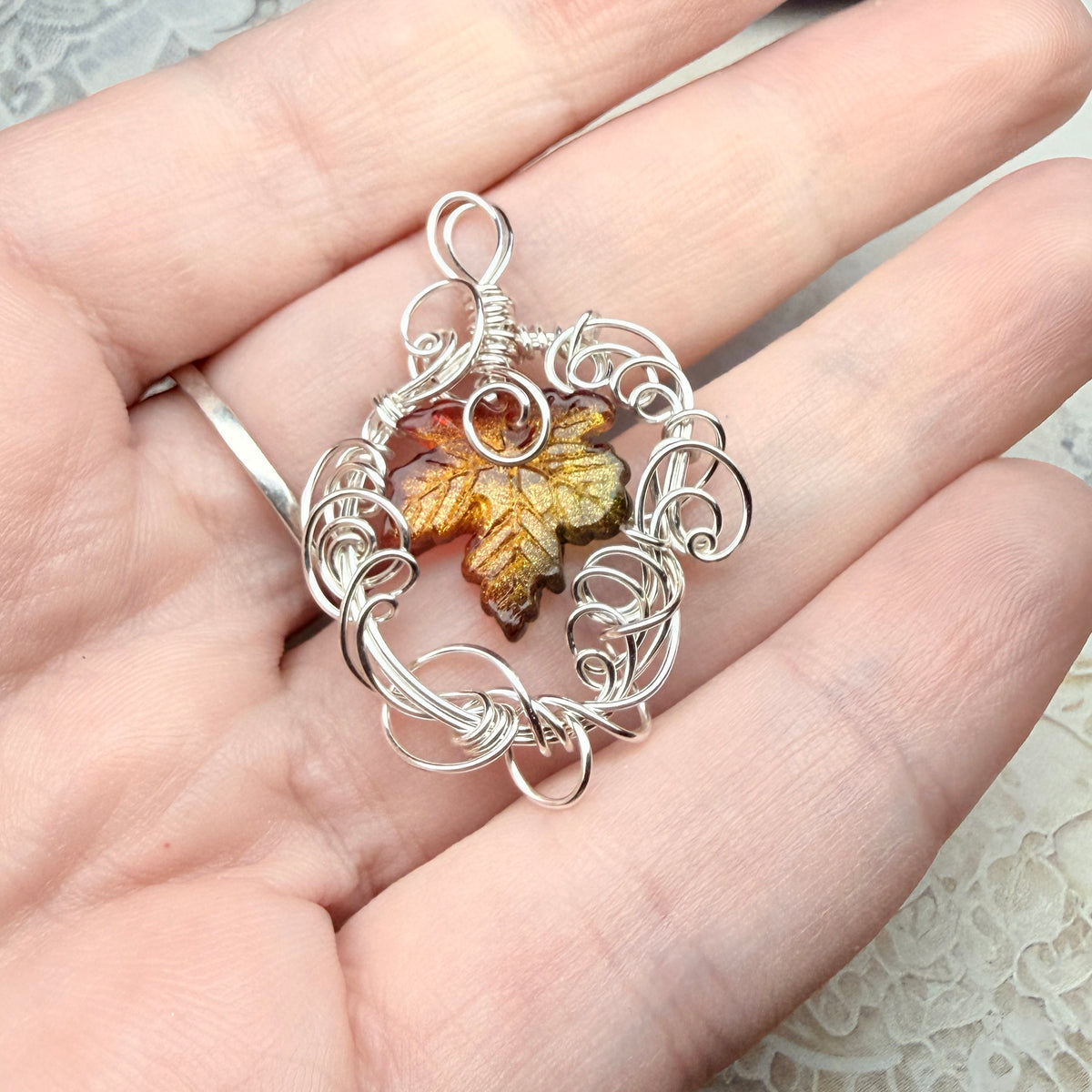 on autumn winds: green and orange leaf pendant