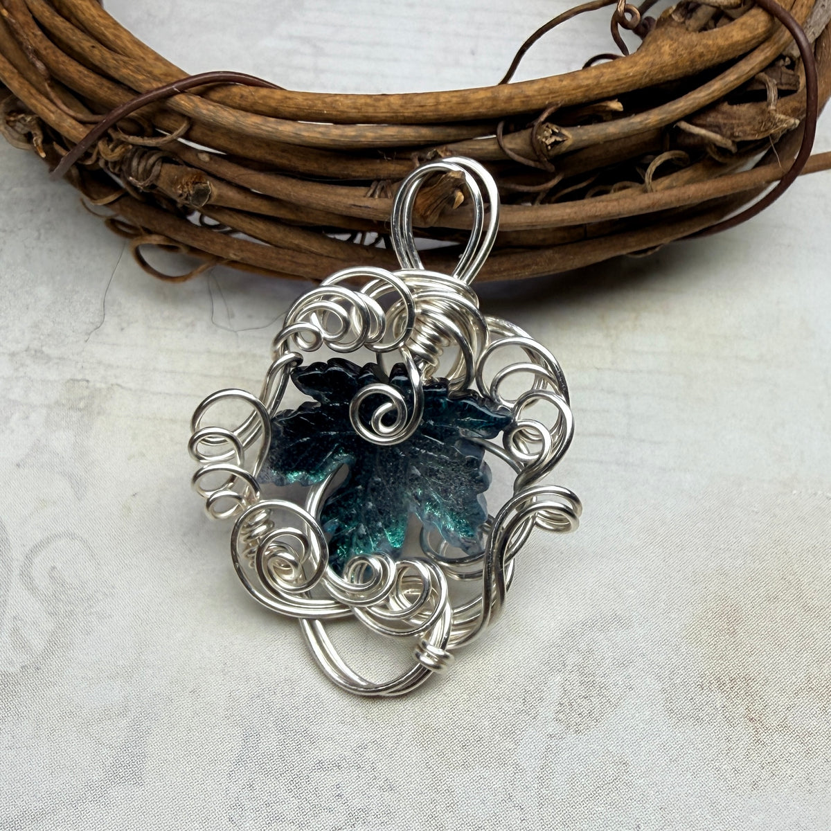 on autumn winds: teal leaf pendant