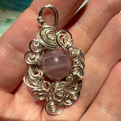 Stillness In The Storm: rose quartz pendant