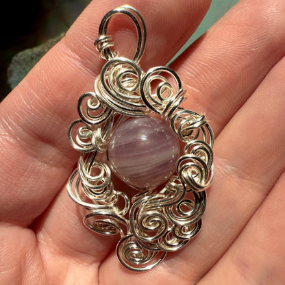 Stillness In The Storm: rose quartz pendant