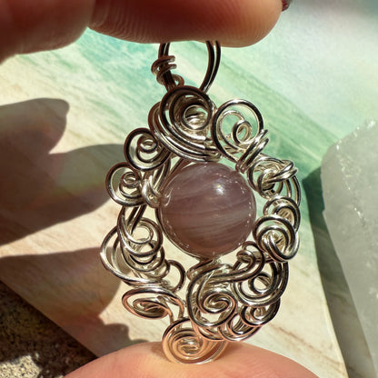 Stillness In The Storm: rose quartz pendant