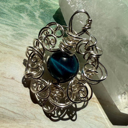 Stillness In The Storm: teal tigerseye pendant