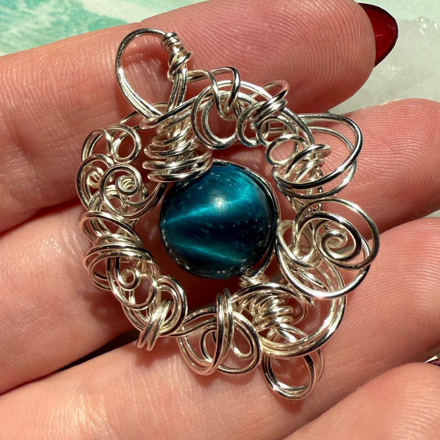 Stillness In The Storm: teal tigerseye pendant