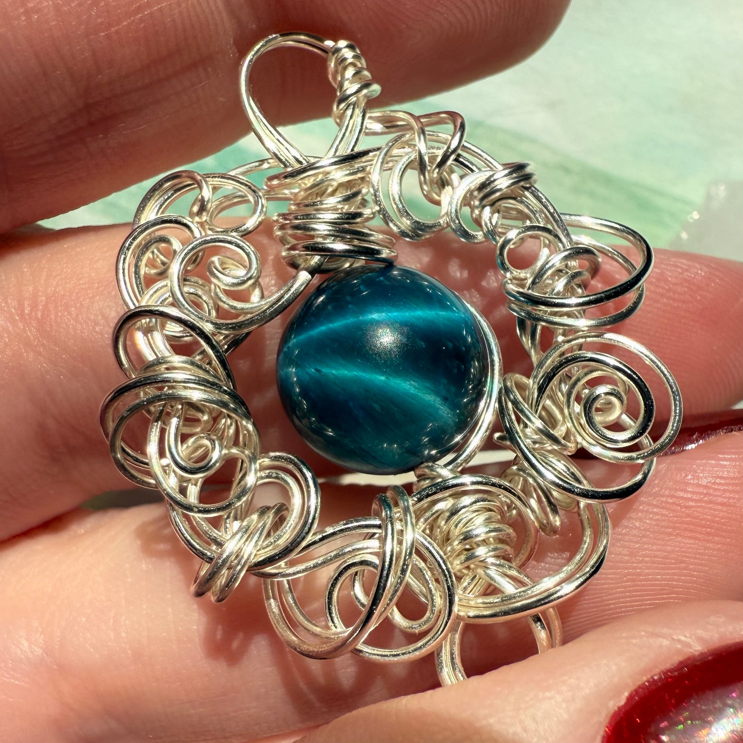 Stillness In The Storm: teal tigerseye pendant