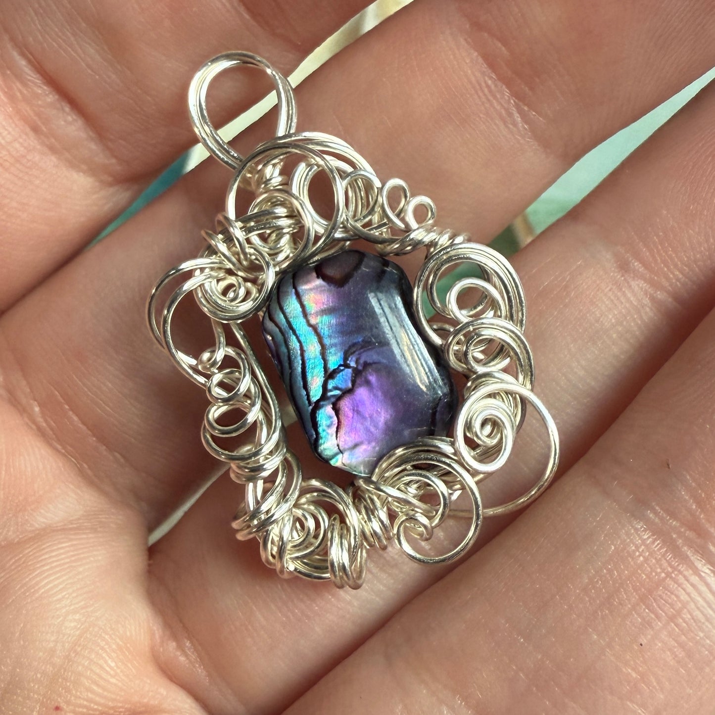 on the turning tide - purple paua shell pendant