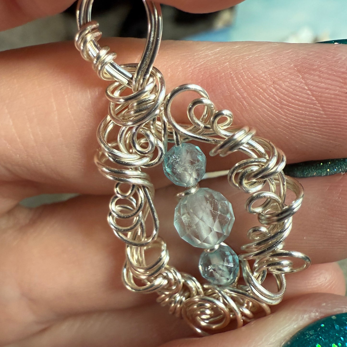 on the turning tide - blue topaz pendant