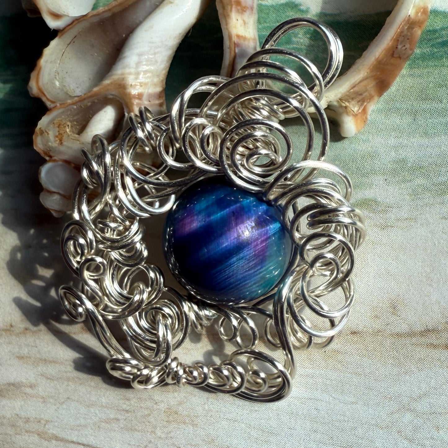 on the turning tide - nebula tigerseye pendant