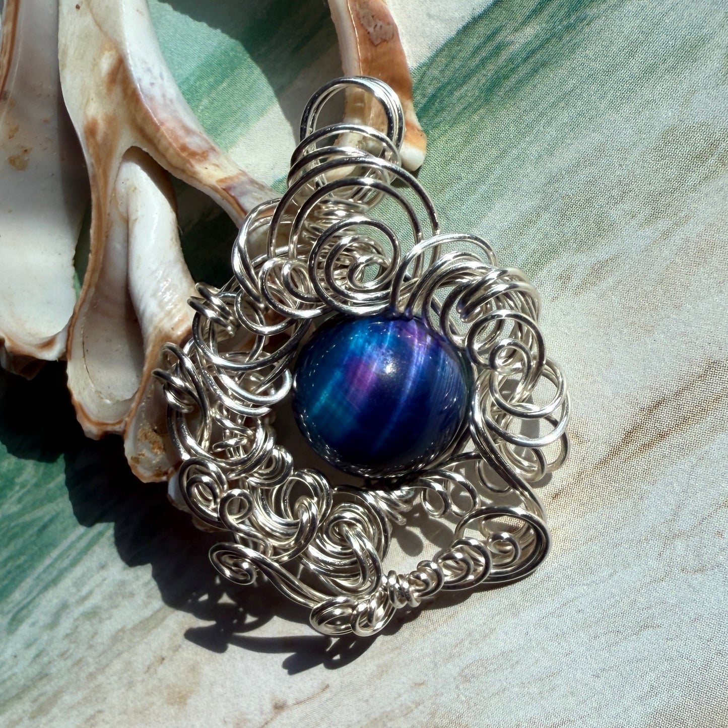 on the turning tide - nebula tigerseye pendant