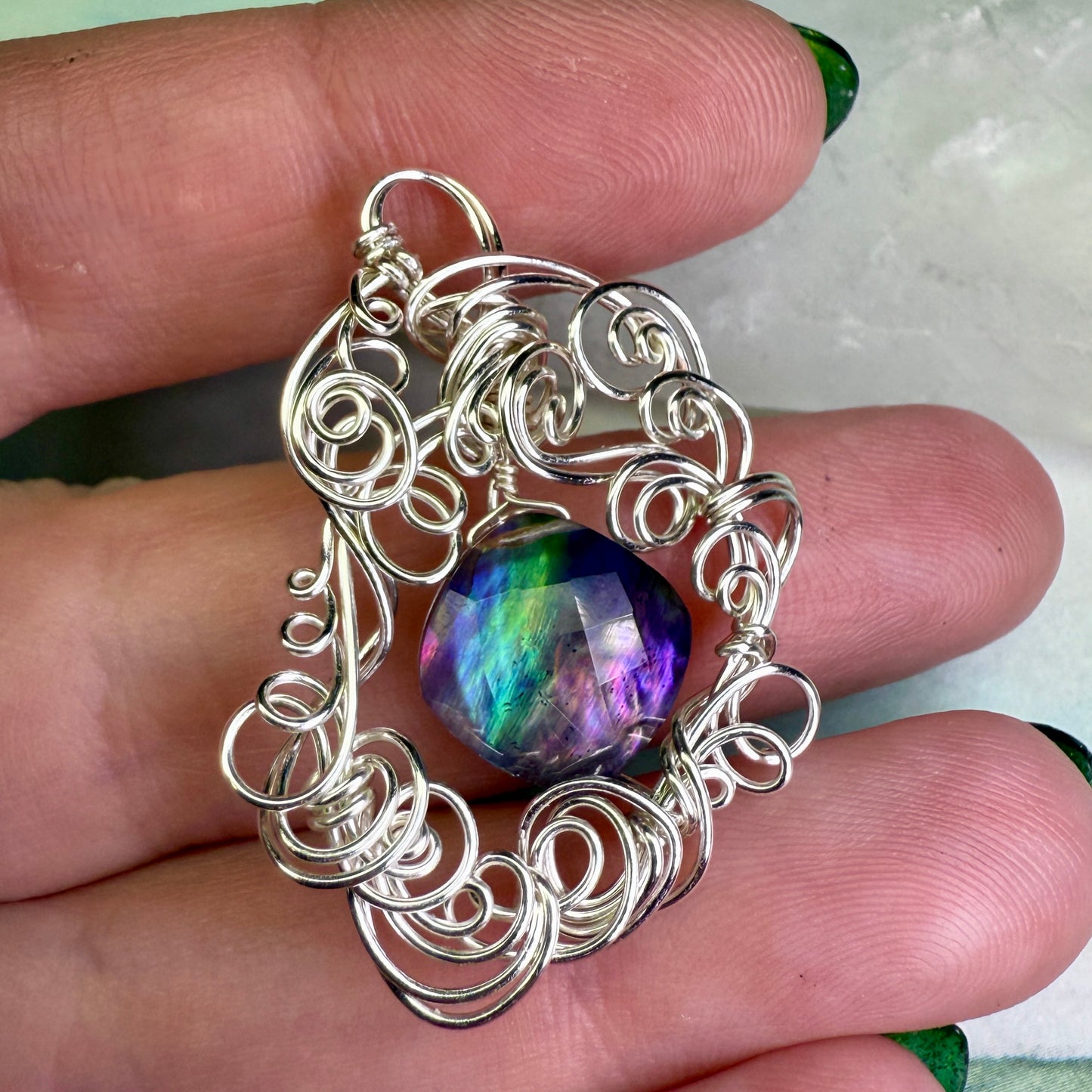 on the turning tide - lighter rainbow aurora pendant