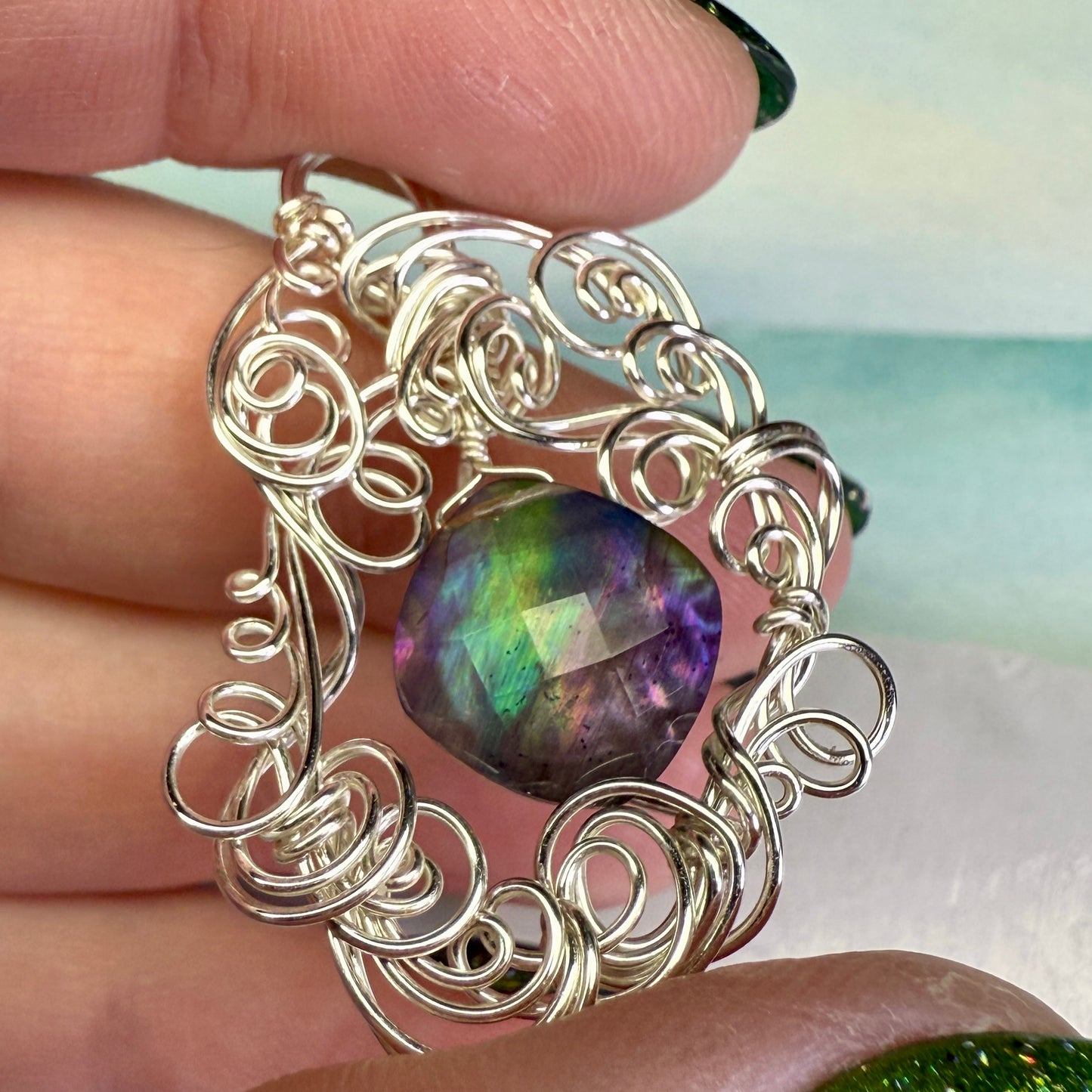 on the turning tide - lighter rainbow aurora pendant