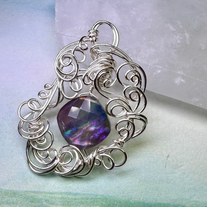 on the turning tide - lighter rainbow aurora pendant