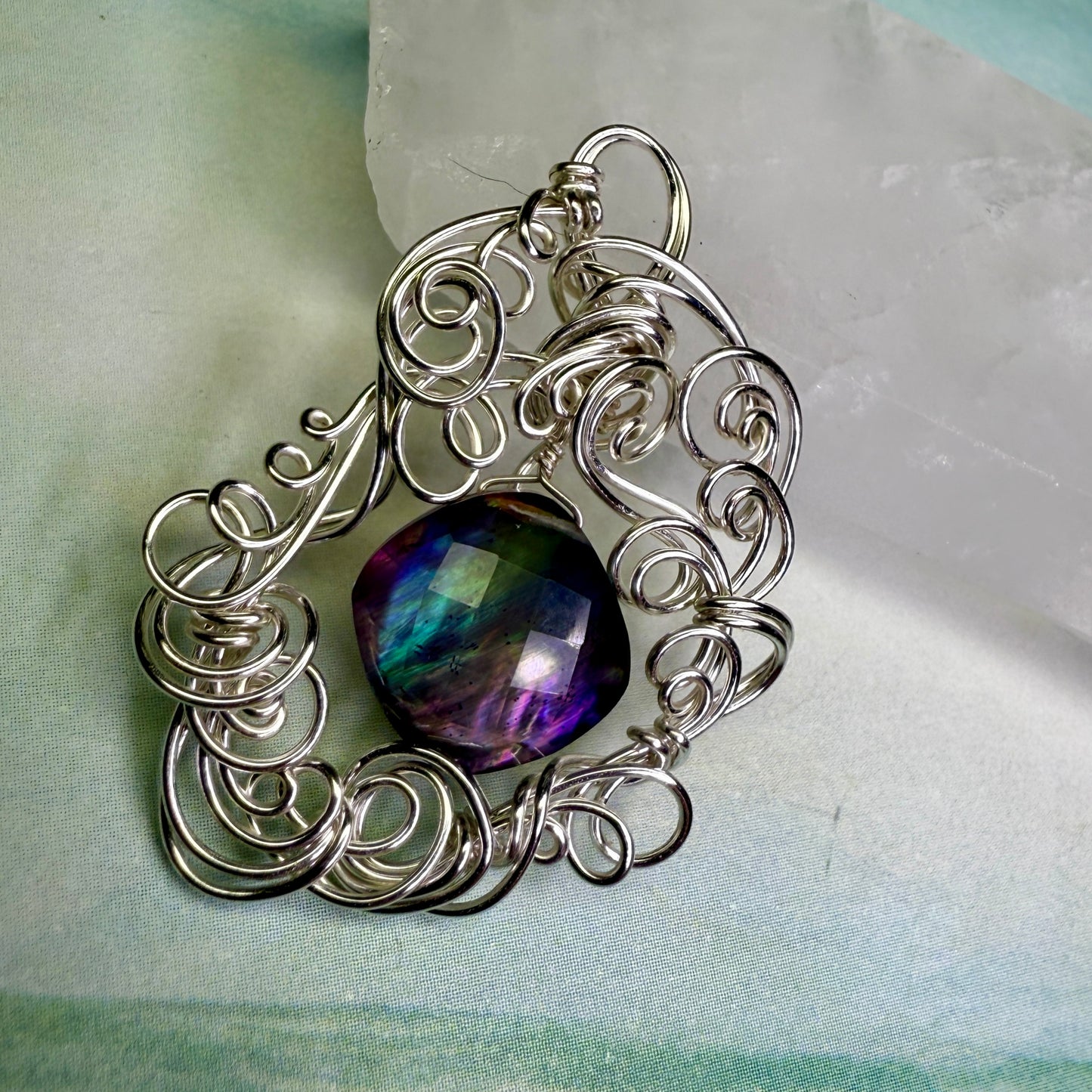 on the turning tide - lighter rainbow aurora pendant
