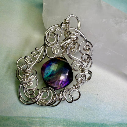 on the turning tide - lighter rainbow aurora pendant